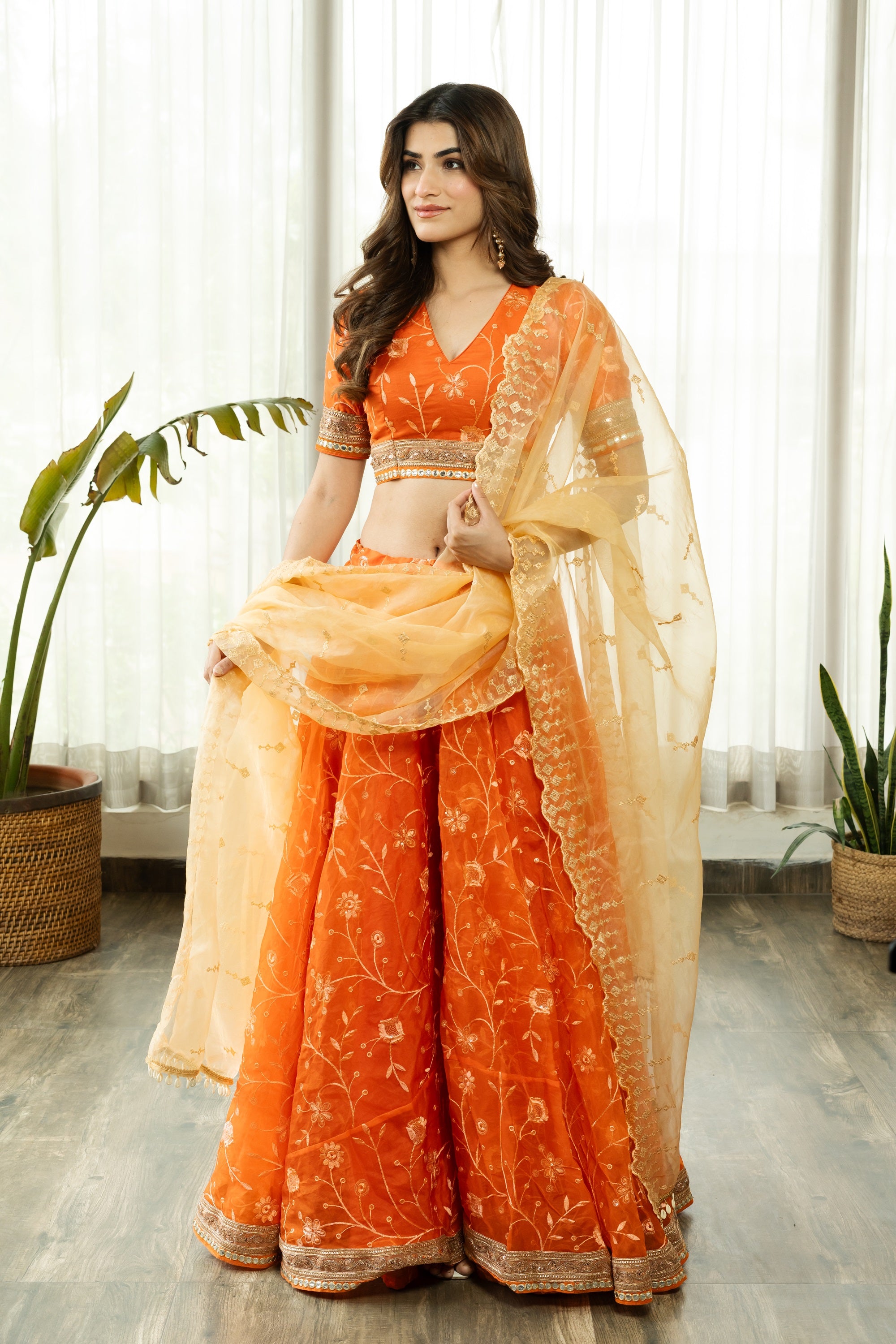 VRISTHI ORANGE EMBELLISHED LEHENGA WITH GOLDEN DUPATTA