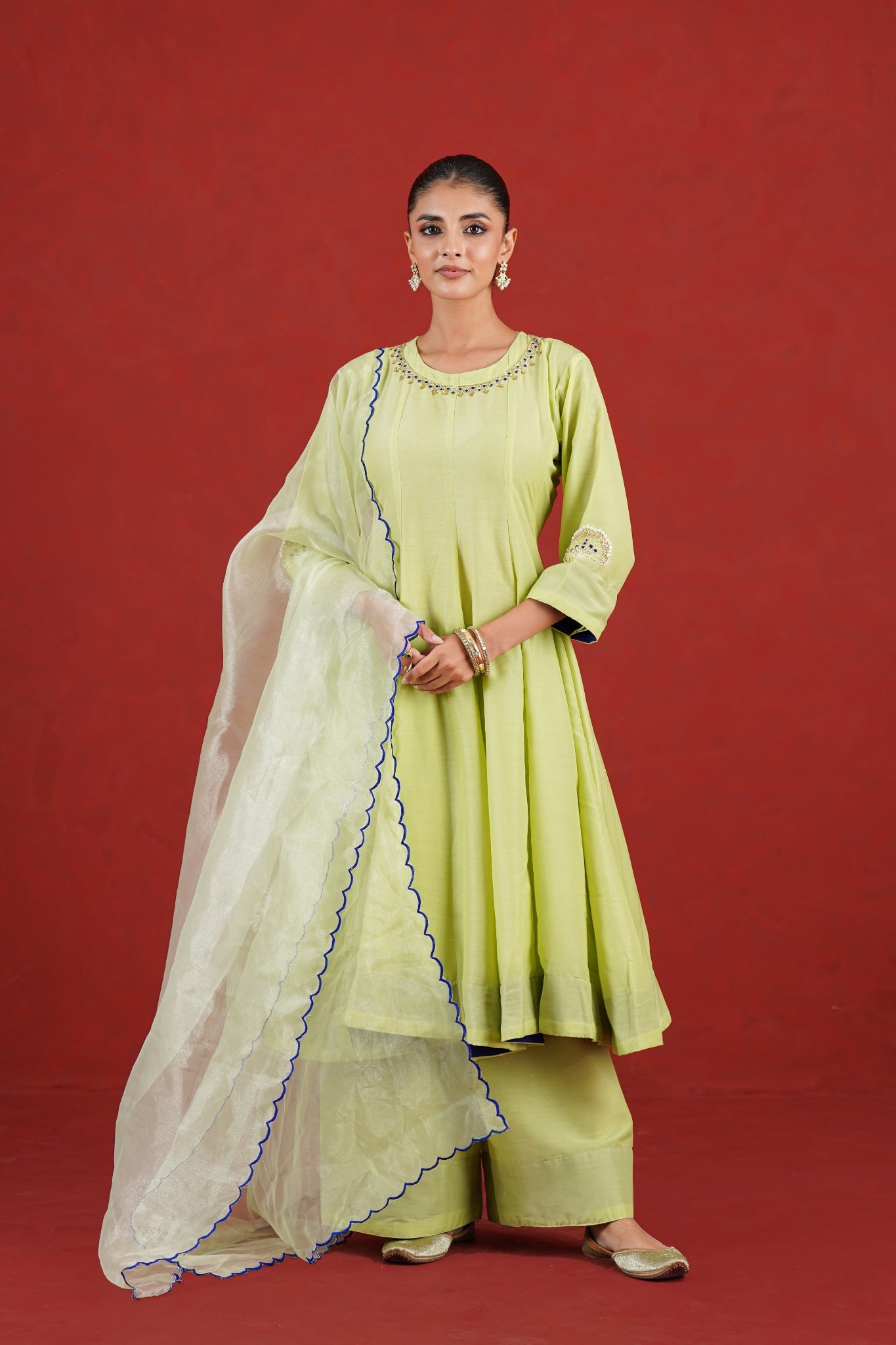 Green hand embroidered festive kurta set with blue edged organza dupatta