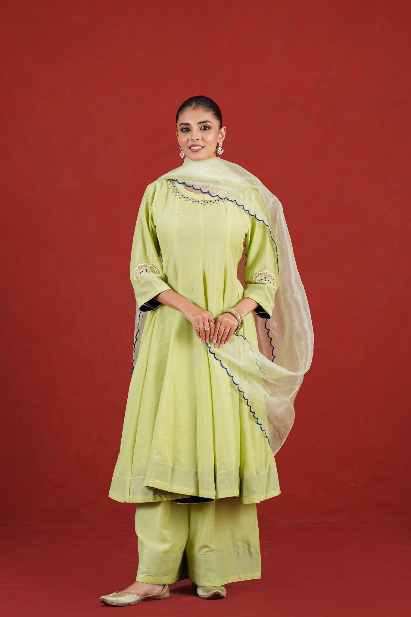 Green hand embroidered kurta set styled with organza dupatta - full length