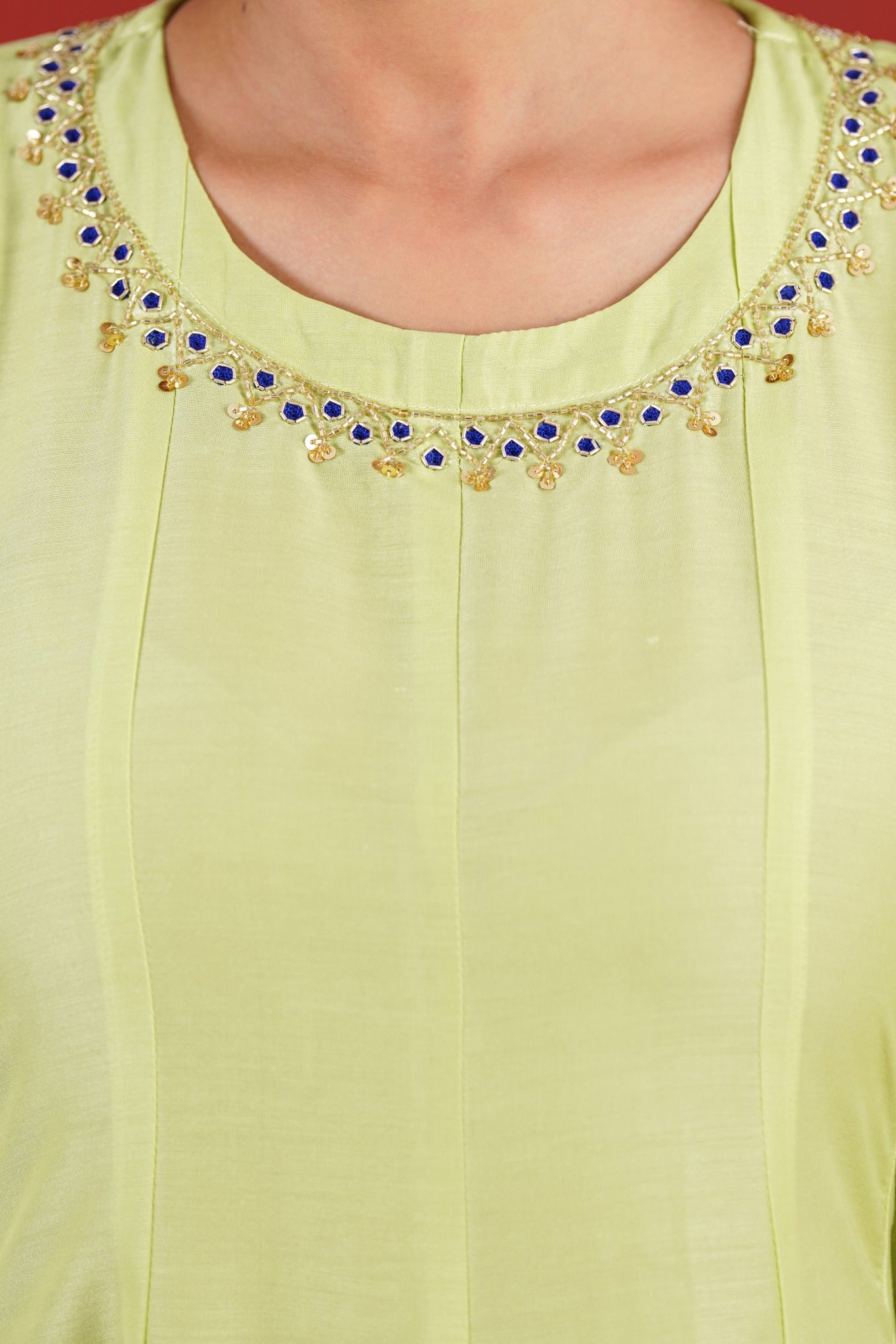 Green kurta hand embroidered sleeve motif detail with pearls and blue accents