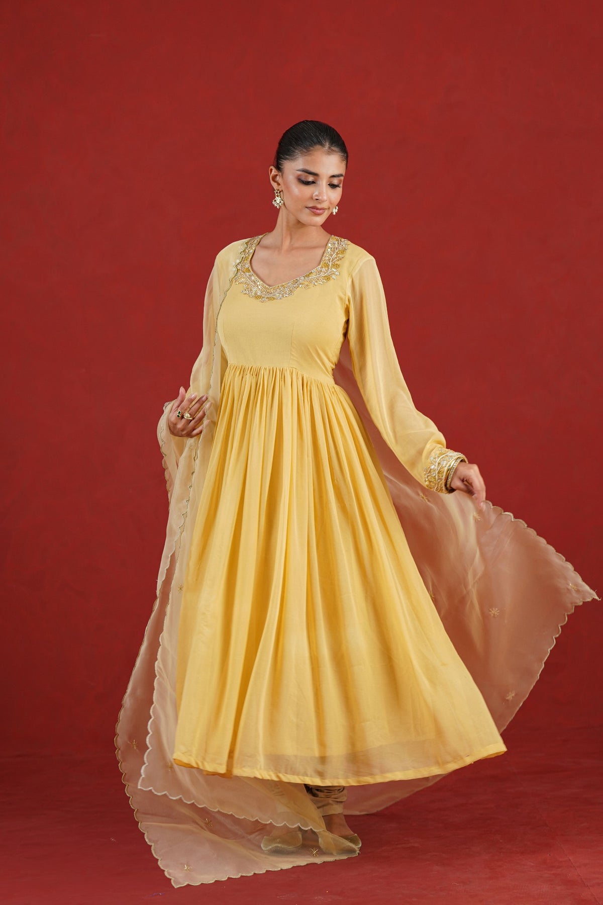 Cream flared chiffon kurta set with embroidered neckline and organza dupatta