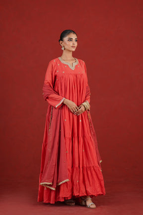 Rust red Chanderi kurta set with hand embroidered neckline and dupatta - angled view