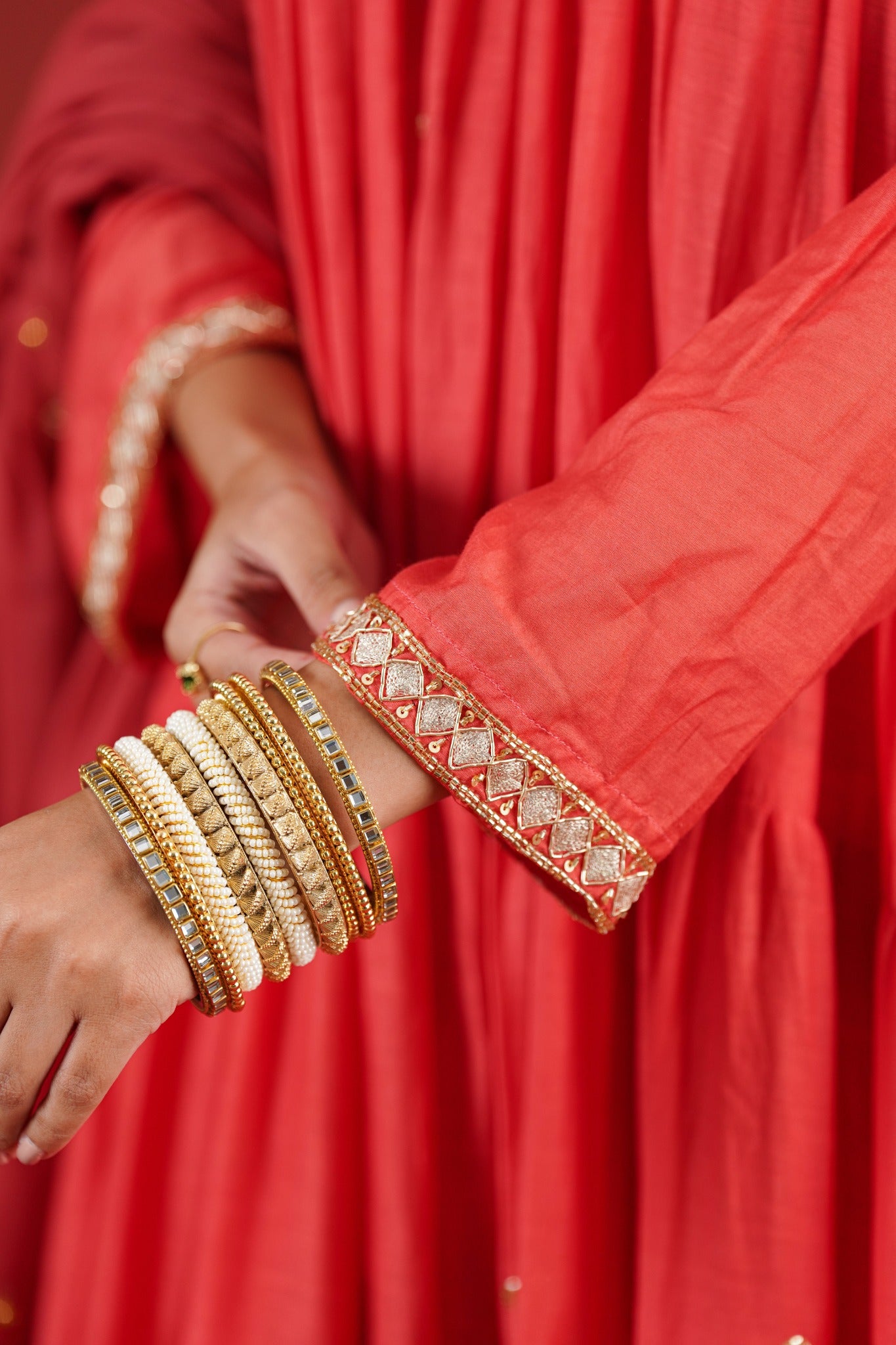 Rust red Chanderi kurta hand embroidered sleeve cuff - close-up