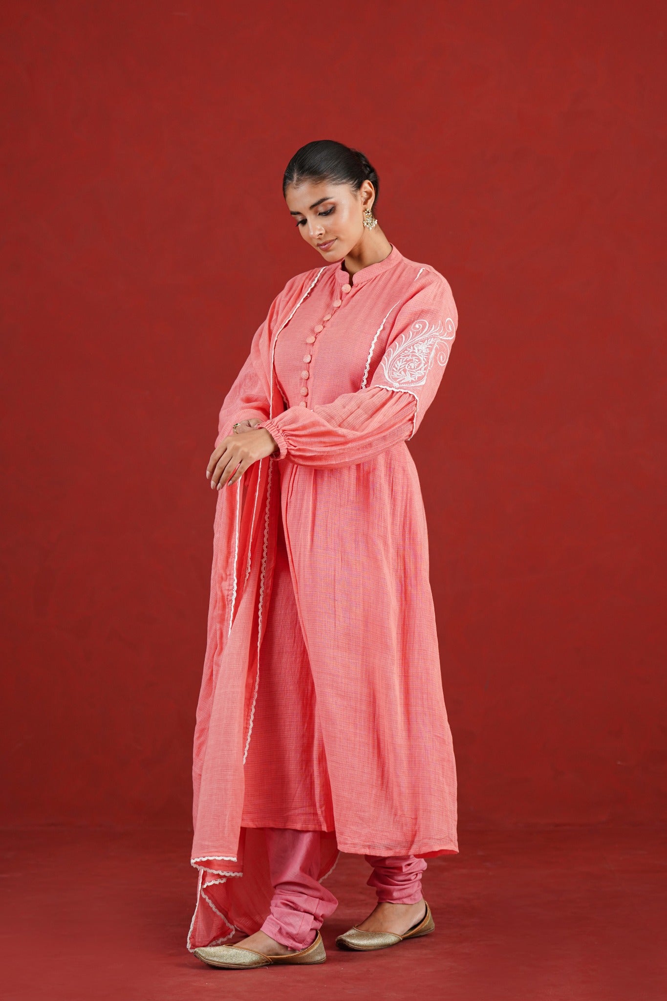 Peach Kota Doriya kurta set with embroidered statement sleeves - angled view