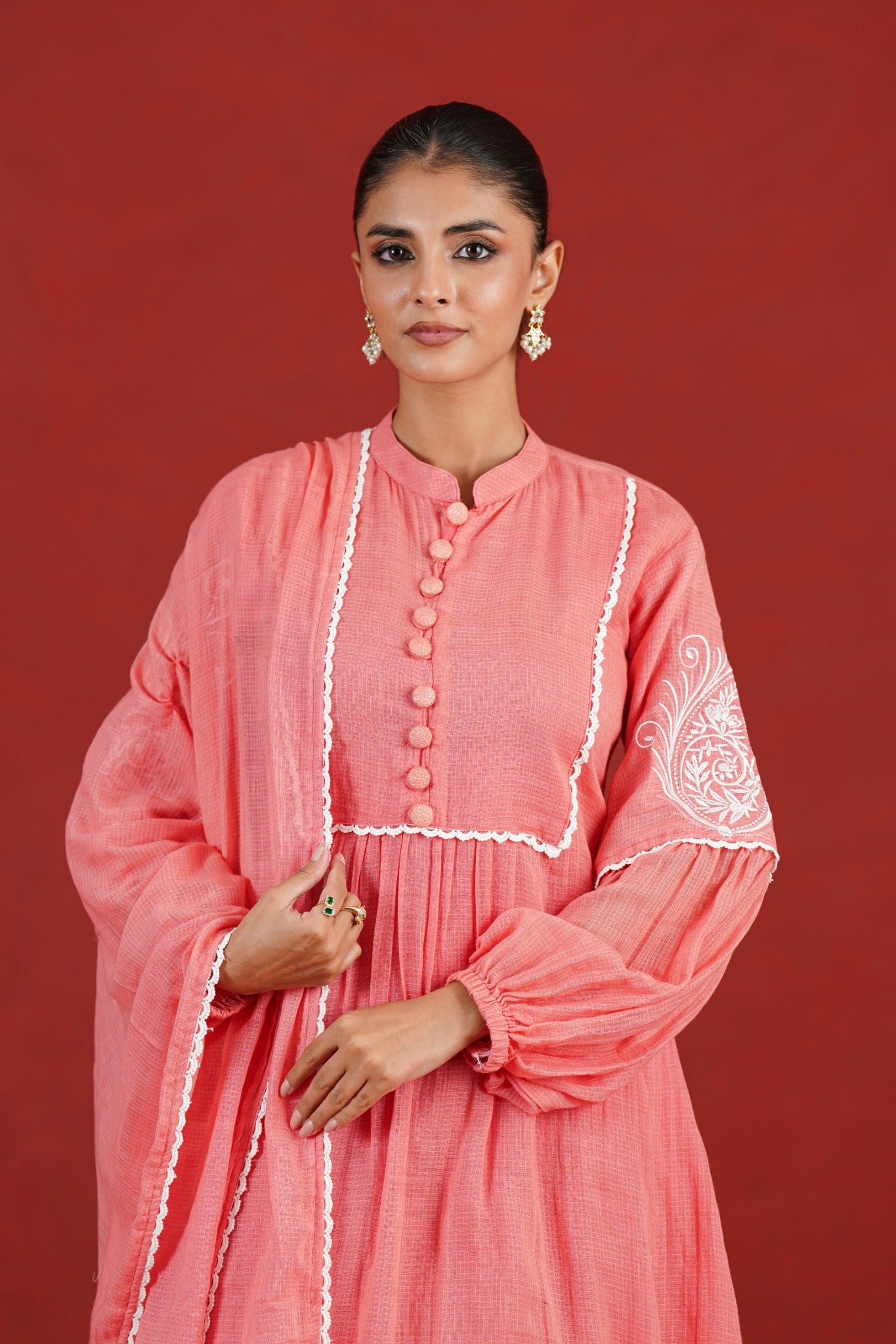 Peach embroidered Kota Doriya kurta with white sleeve motif - upper body detail