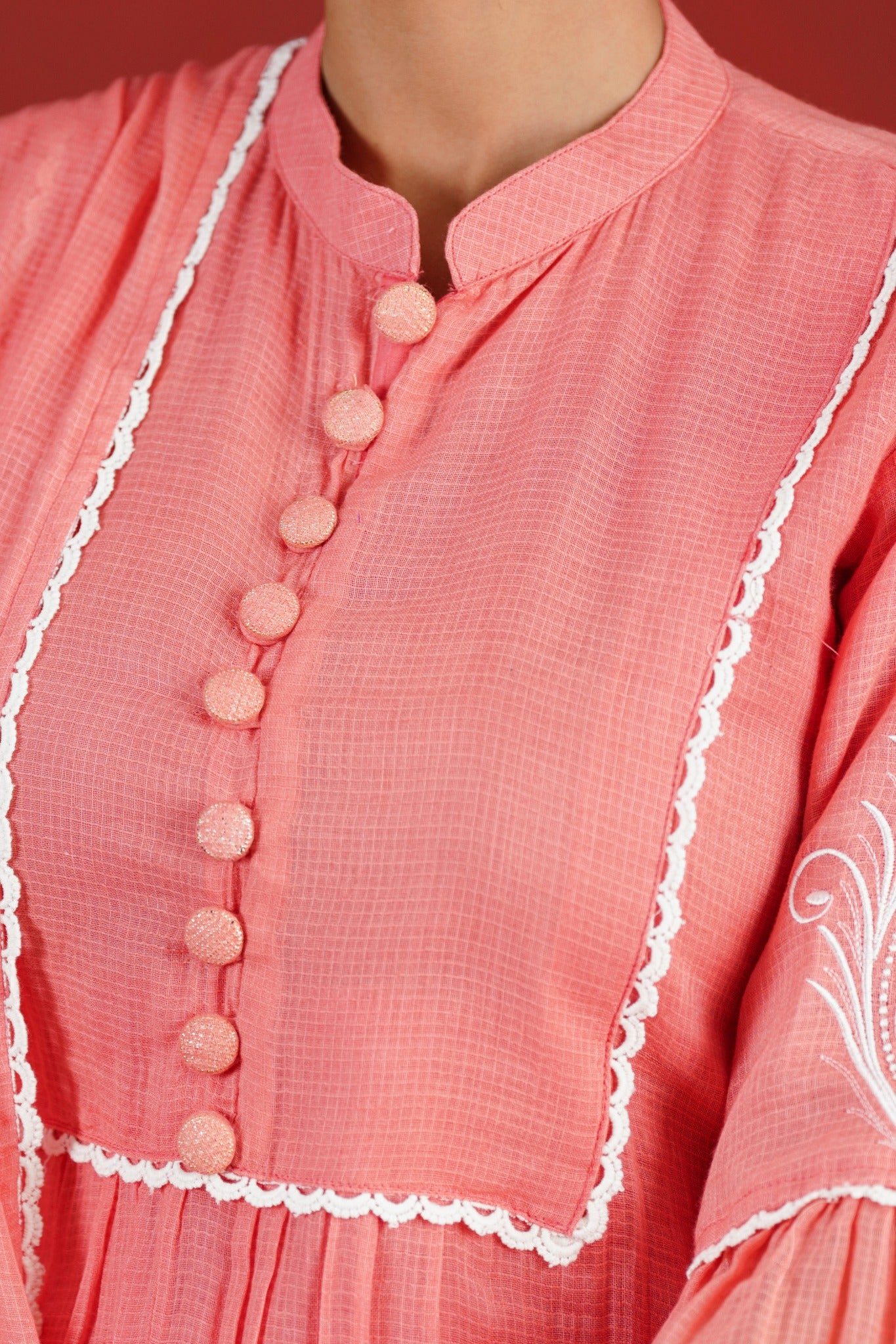 Peach Kota Doriya kurta fabric buttons and white lace yoke detail - close-up