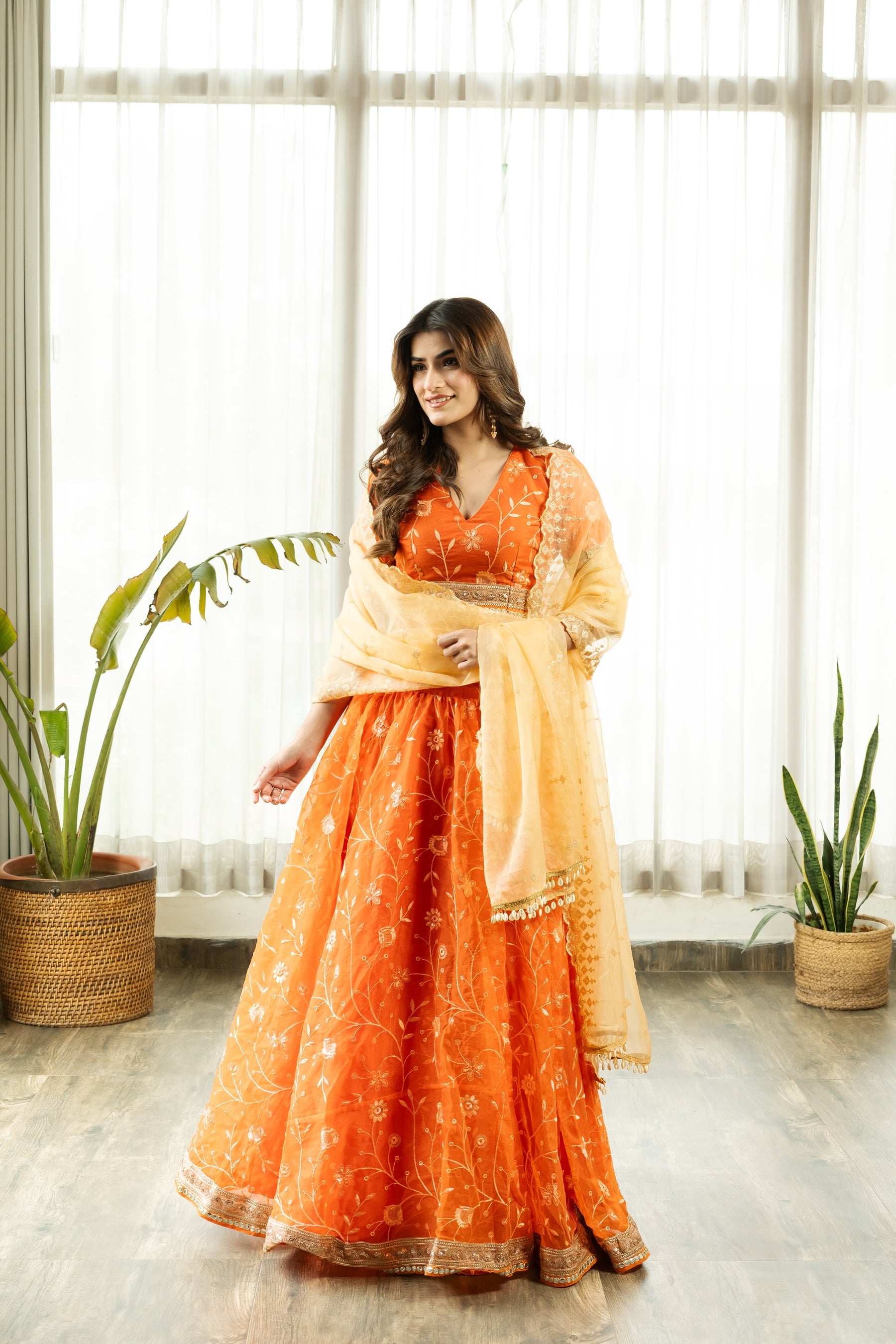 VRISTHI ORANGE EMBELLISHED LEHENGA WITH GOLDEN DUPATTA