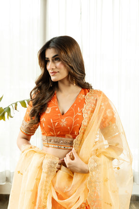 VRISTHI ORANGE EMBELLISHED LEHENGA WITH GOLDEN DUPATTA