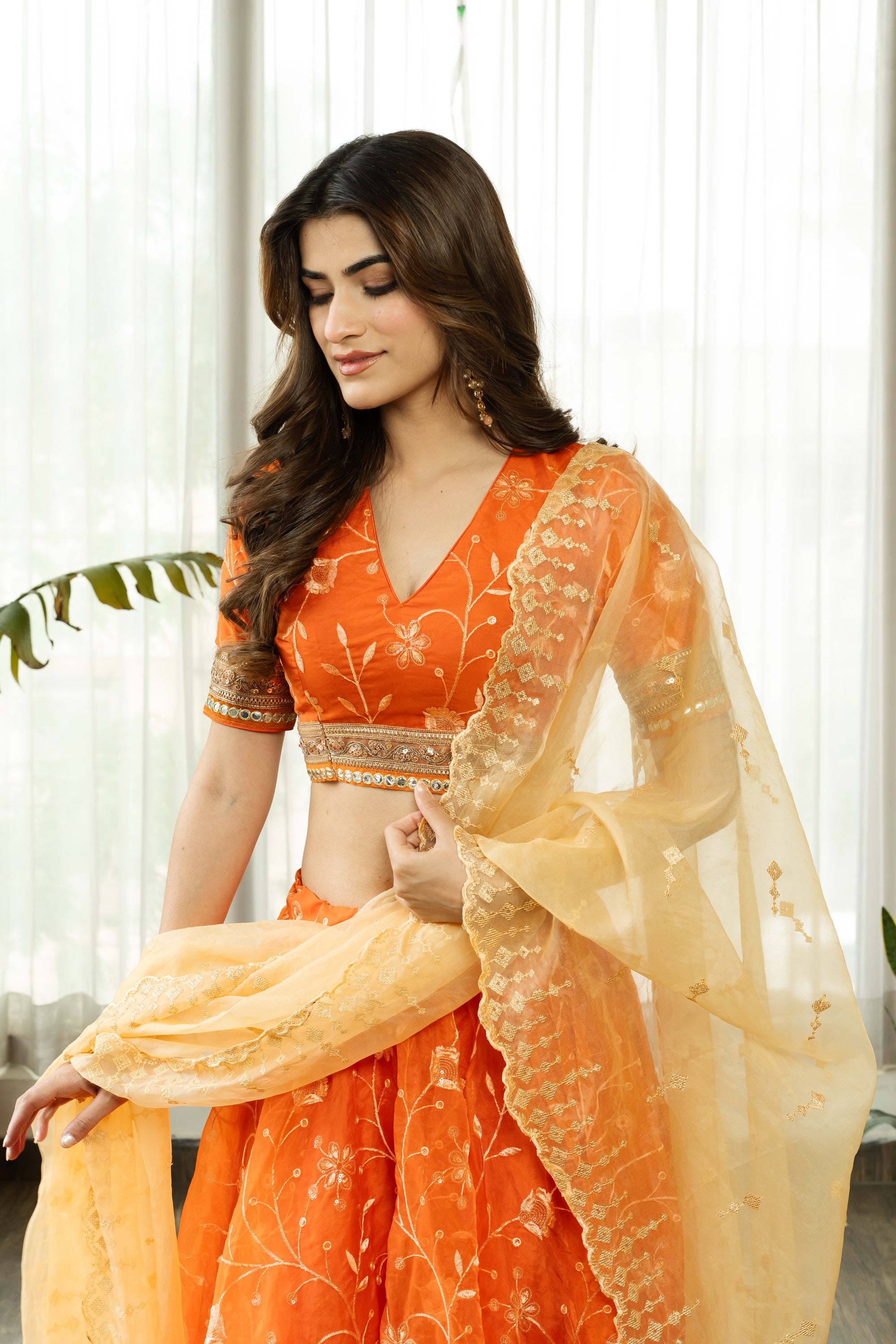 VRISTHI ORANGE EMBELLISHED LEHENGA WITH GOLDEN DUPATTA