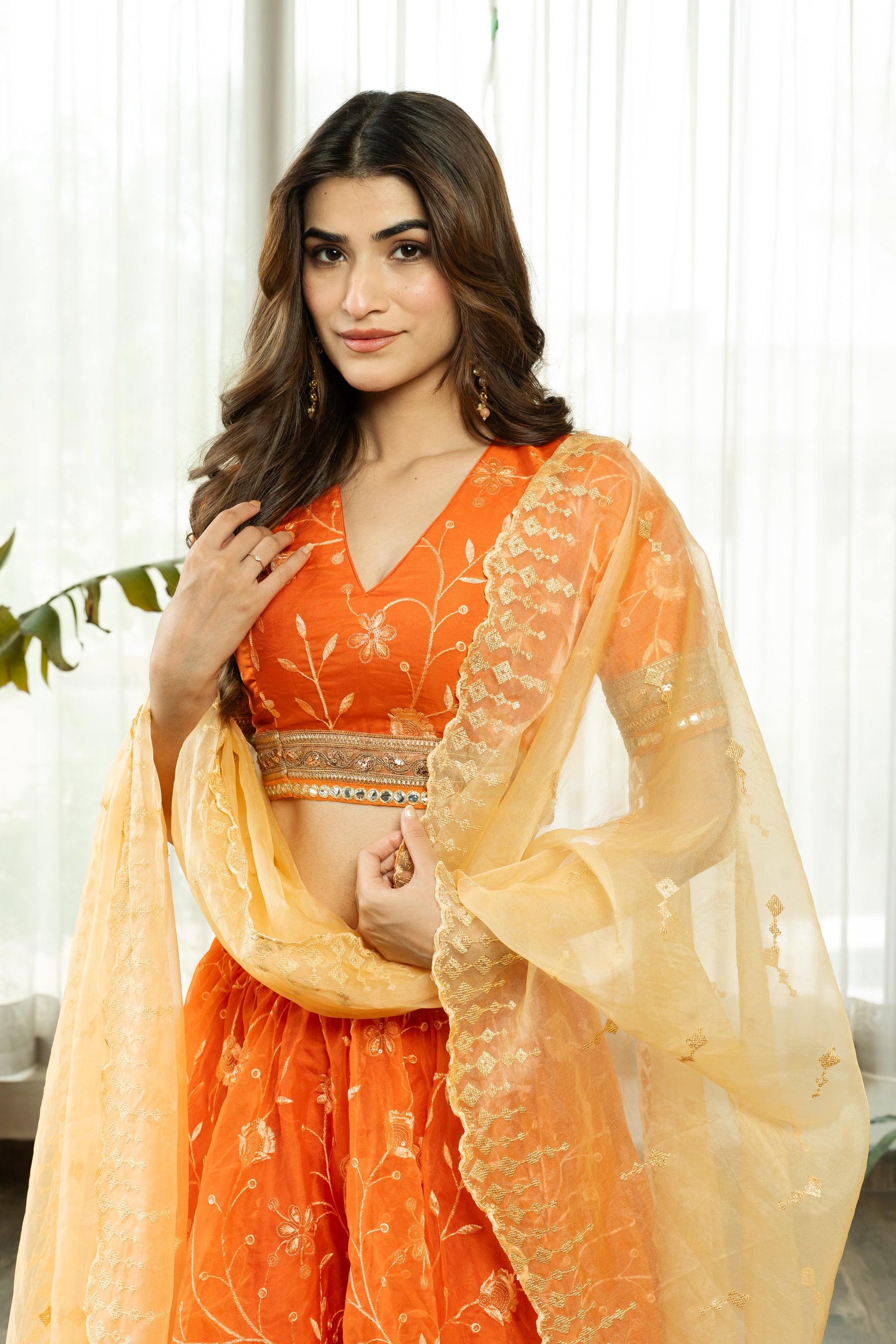 VRISTHI ORANGE EMBELLISHED LEHENGA WITH GOLDEN DUPATTA