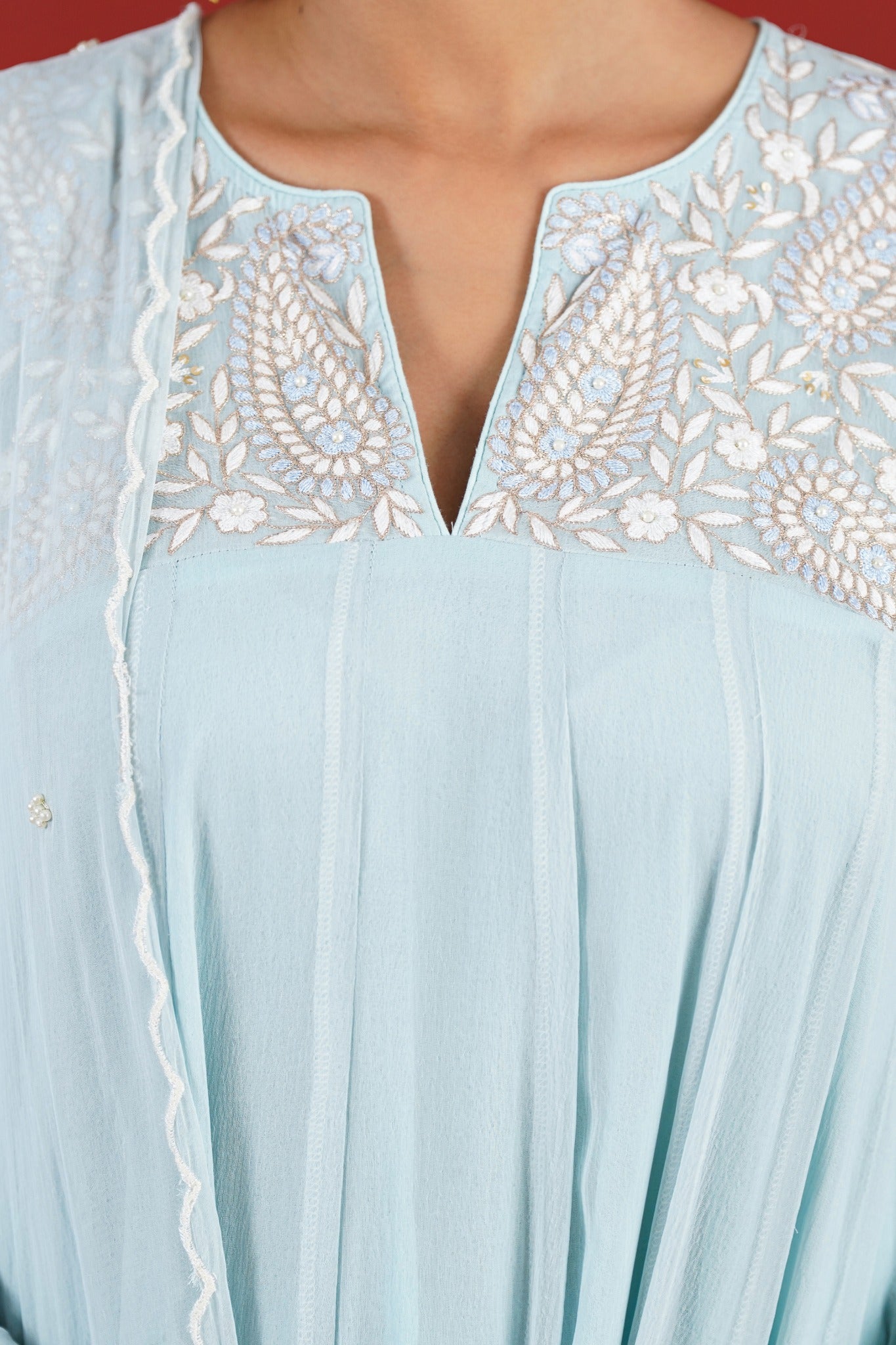 Aasma blue hand embroidered neckline close up