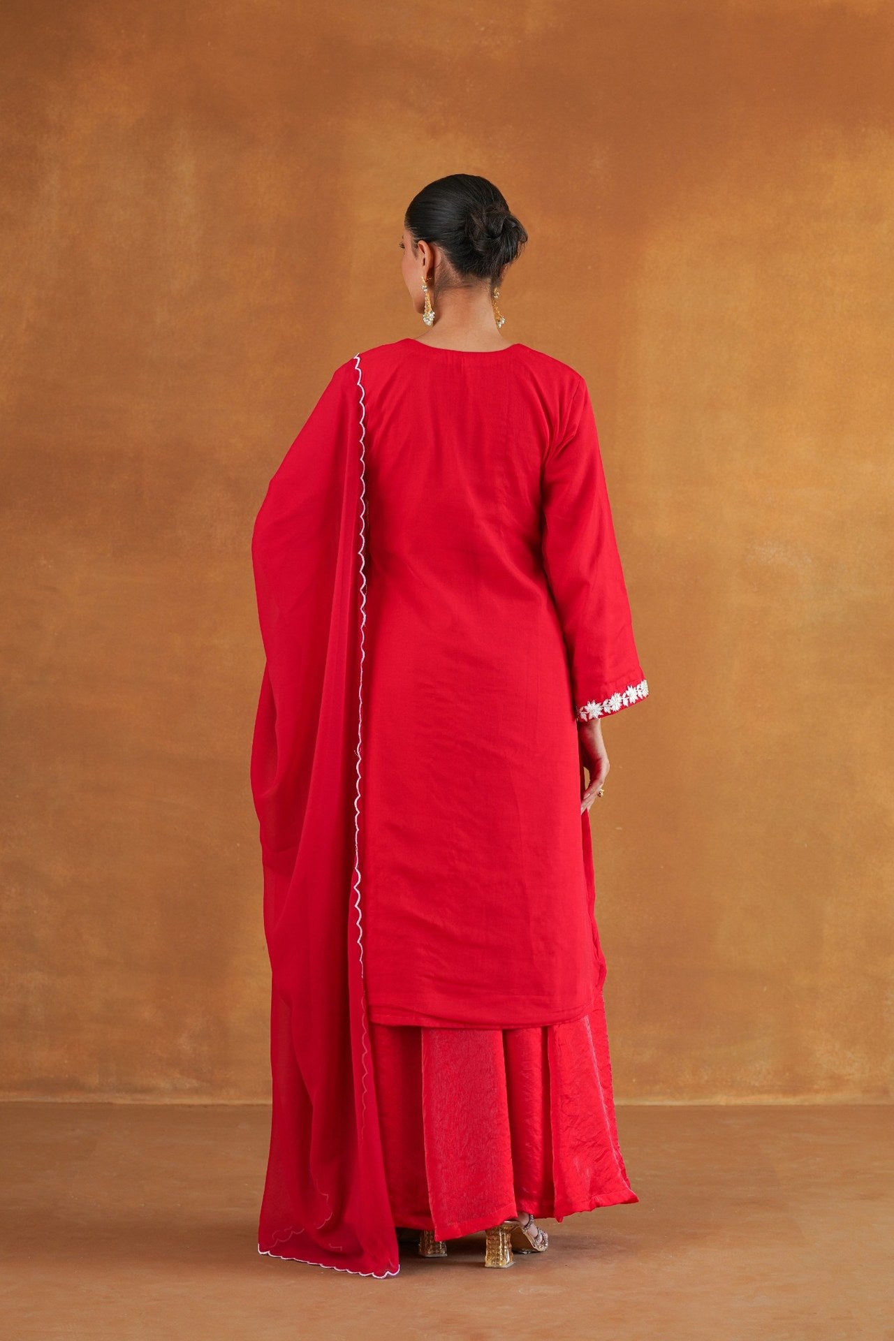 Gulnaar red embroidered kurta set front view